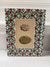 Two antique egg engravings in green/red art paper frames